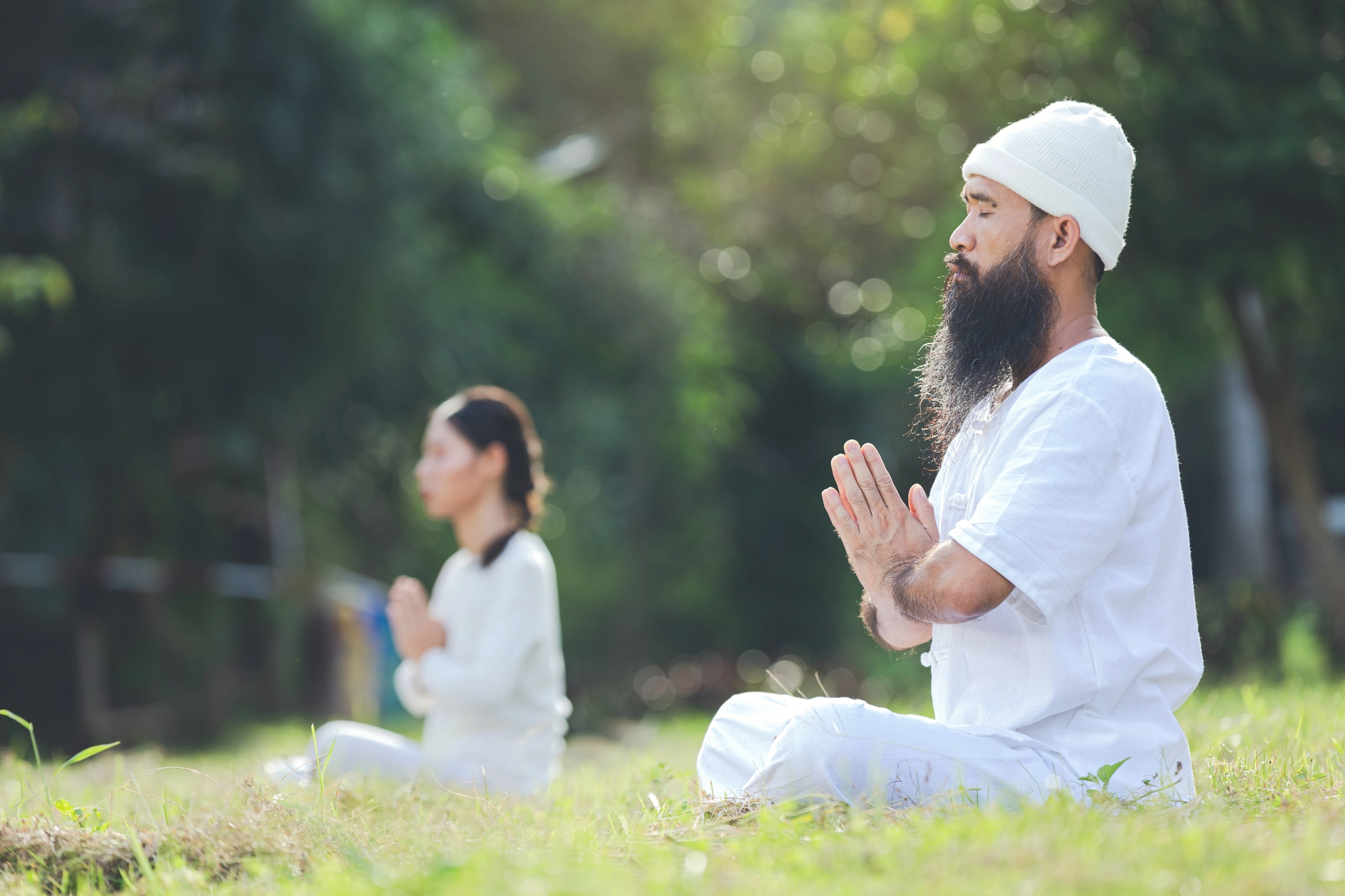 two-people-white-outfit-meditati